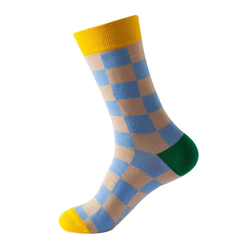 Checkered sock with yellow, blue, and green colors on a white background