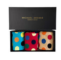 Three pairs of polka dot socks in a black box with 'Michael Archer' branding.