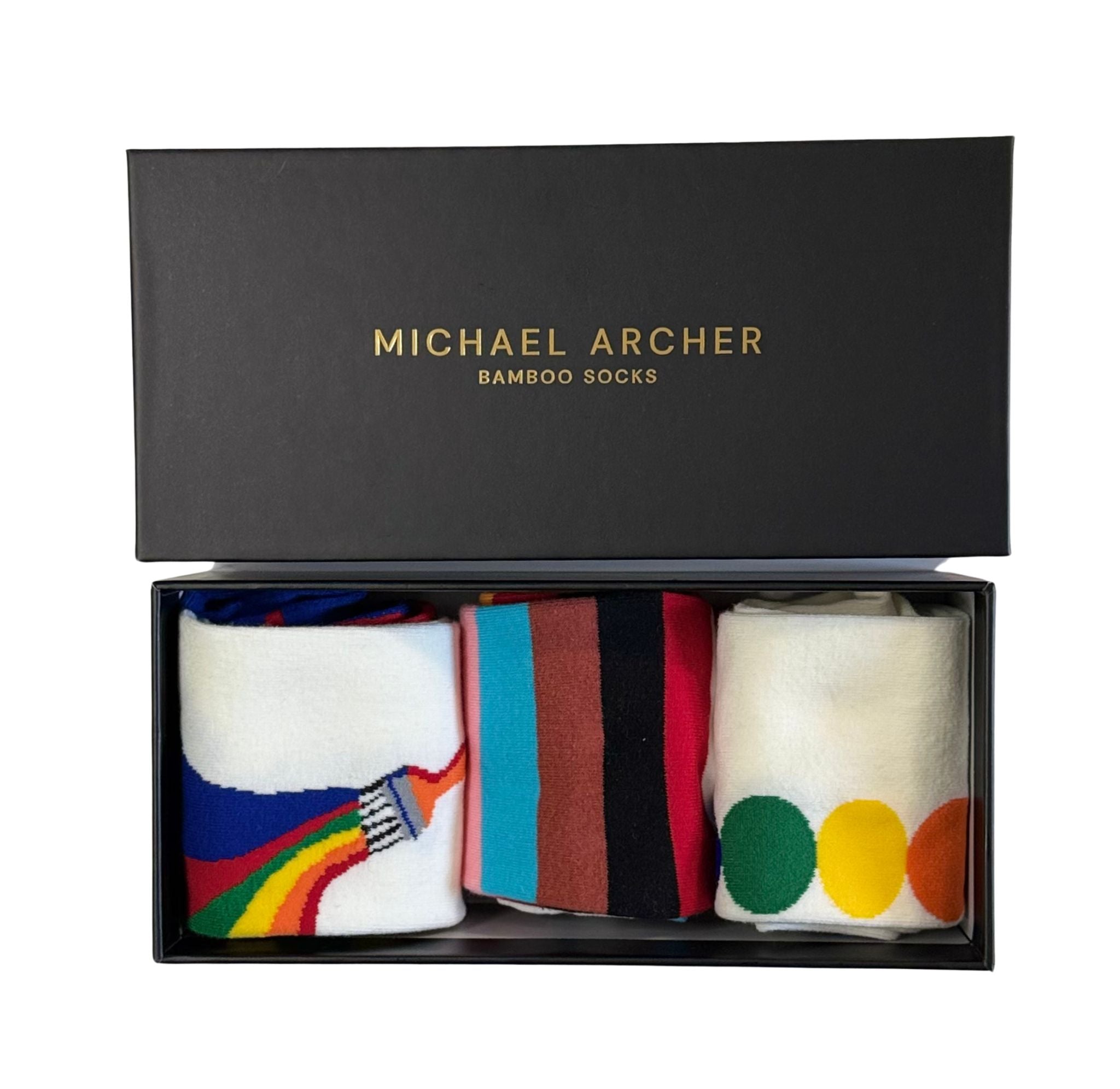 Box of Michael Archer bamboo socks with colorful designs on a white background