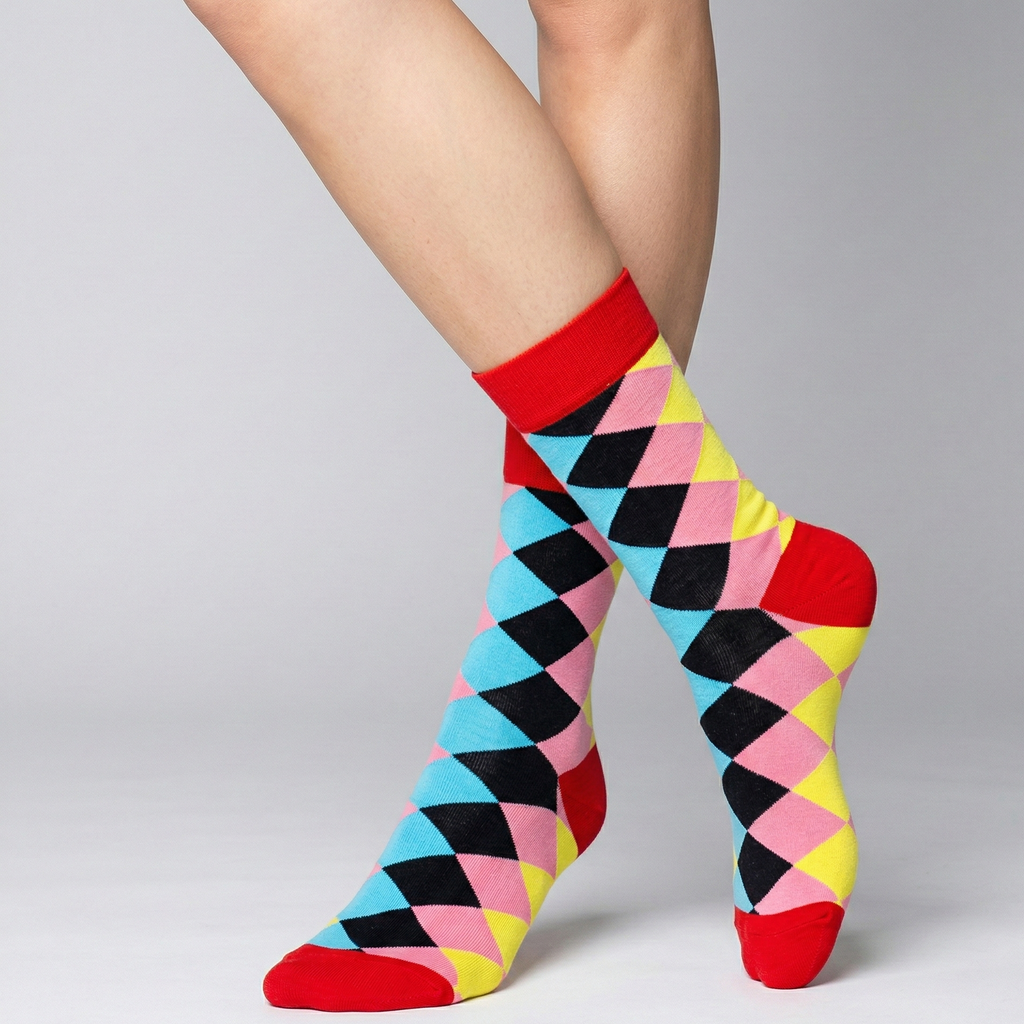 Colorful diamond-patterned socks worn by a person on a gray background