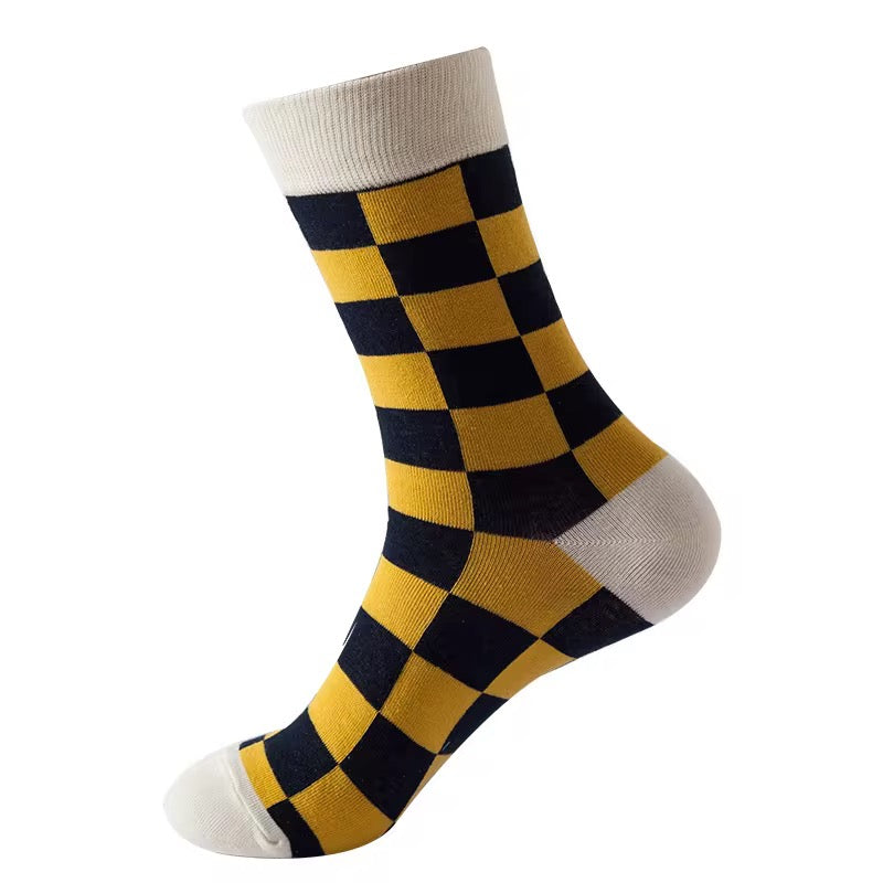 Checkered sock with yellow and navy pattern on a white background